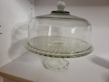 LARGE GLASS CAKE PLATE WITH STAND. IS SOLD AS IS WHERE IS WITH NO GUARANTEES OR WARRANTY, NO REFUNDS