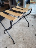 VINTAGE IRON AND BURLAP STRAPPED FOLDING LUGGAGE RACK. MEASURES APPROX. 17 D X 27 W X 24 H. IS SOLD
