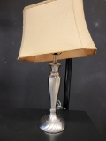 NICKEL PLATED TABLE LAMP WITH GOLD COLORED SHADE. MEASURES APPROX. 24IN H. IS SOLD AS IS WHERE IS