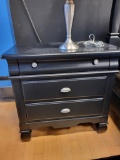 AMERICAN SIGNATURE BLACK SOLID WOOD 3 DRAWER NIGHT STAND. NICKEL PLATED DRAWER PULLS. MEASURES