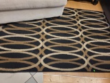 SIGNATURE DESIGN BY ASHLEY KLYE CLAY RUG. MEASURES APPROX. 52IN X 81 IN. IS SOLD AS IS WHERE IS WITH