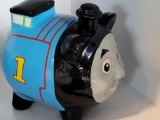 THOMAS THE TRAIN CERAMIC COIN BANK. IS SOLD AS IS WHERE IS WITH NO GUARANTEES OR WARRANTY, NO