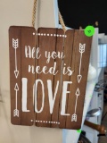 ALL YOU NEED IS LOVE WALL DECOR. IS SOLD AS IS WHERE IS WITH NO GUARANTEES OR WARRANTY, NO REFUNDS