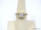 BEAUTIFUL 14K YELLOW GOLD AND DIAMOND RING. FEATURES FOUR PRINCESS CUT DIAMONDS ON THE TOP, WHICH