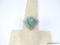 .925 STERLING SILVER DYED GREEN BERYL (EMERALD) AND WHITE SAPPHIRE RING. CONTAINS: ONE CABOCHON DYED