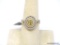 14K YELLOW GOLD WHITE & YELLOW DIAMOND CUSTOM MADE RING. FEATURING A CENTER OVAL CUT FANCY