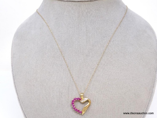 10K YELLOW GOLD RUBY AND DIAMOND HEART PENDANT ON 10K YELLOW GOLD CHAIN. THE PENDANT FEATURES 10