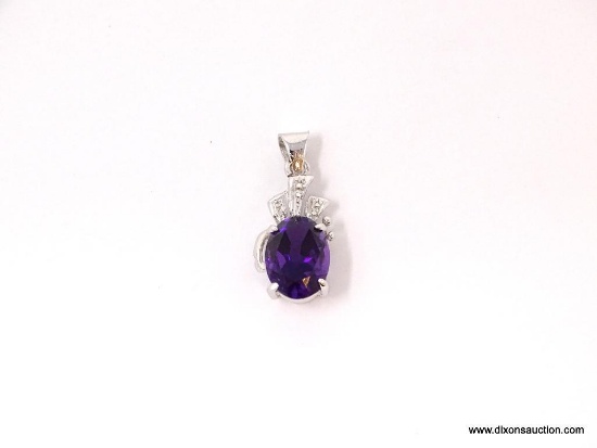 STERLING SILVER & AMETHYST PENDANT. OVAL CUT PRONG SET AMETHYST STONE WITH CZ CHIPS PLACED ABOVE.