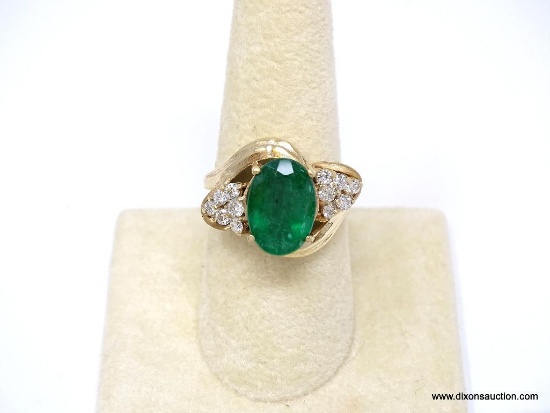 14K YELLOW GOLD EMERALD AND DIAMOND RING WITH NICE PIERCED DETAILING. LARGE PRONG SET 5.63 CARAT