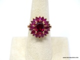 .925 STERLING SILVER GOLD OVERLAY RUBY FLOWER RING WITH A BRIGHT POLISH FINISH. THIS RING FEATURES A