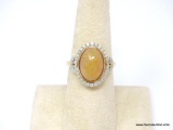 14K YELLOW GOLD OVERLAYED OVER .925 STERLING SILVER OPAL & DIAMOND RING. FEATURES ONE OVAL SHAPED