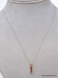 10K YELLOW GOLD TRIPLE RUBY PENDANT WITH 10K YELLOW GOLD CHAIN. THREE ROUND CUT RUBY GEMSTONES SET