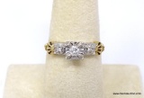 14K YELLOW & WHITE GOLD DIAMOND RING. APPROX. 1/4 CARAT ROUND CUT DIAMOND, PRONG SET IN THE CENTER
