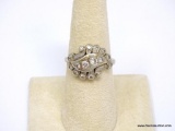 14K WHITE GOLD & DIAMOND ART DECO RING. FEATURES 4 ROUND DIAMONDS SET IN THE MIDDLE, 2 MEASURE