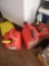 (SHED 2) SET OF 4 RED GAS CANS, 2 ARE 5 GALLONS AND ARE EMPTY, THE OTHER 2 ARE 1 GALLON CONTAINERS