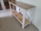 (BED3) MODERN FARMHOUSE STYLE WHITE DISTRESSED AND NATURAL WOOD CONSOLE/HALL TABLE.