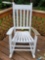 (DECK) WHITE PAINTED WOODEN SLAT STYLE ROCKING CHAIR.