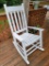 (DECK) WHITE PAINTED WOODEN SLAT STYLE ROCKING CHAIR.