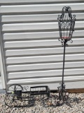 (SHED1OUT) 2 PIECE LOT OF METAL DECOR. INCLUDES A TALL WROUGHT IRON LANTERN STYLE CANDLE HOLDER AND