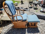 (SHED2) VINTAGE WOODEN GLIDER AND OTTOMAN WITH BLUE UPHOLSTERED CUSHIONS.