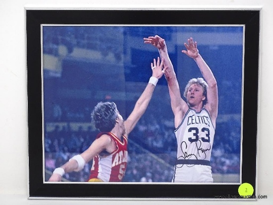 FRAMED & AUTOGRAPHED PHOTOGRAPH OF #33 LARRY BIRD OF THE BOSTON CELTICS. SIGNED IN BLACK MARKER.