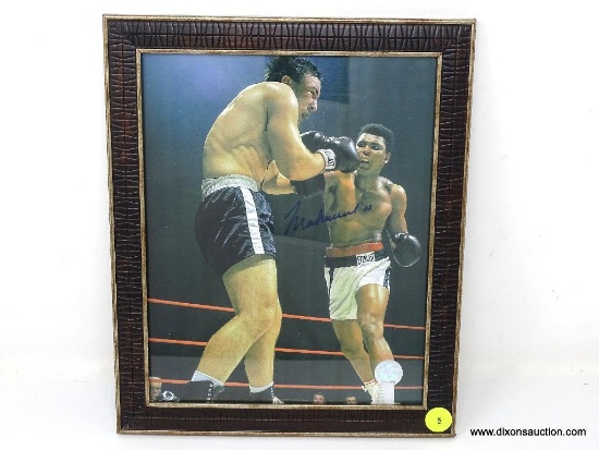 FRAMED & AUTOGRAPHED PHOTOGRAPH OF MUHAMMAD ALI'S FIGHT AGAINST GEORGE CHUVALO. SIGNED IN BLACK