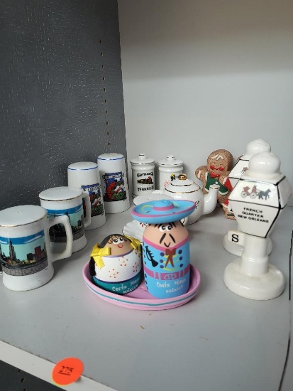 LOT OF 7 DIFFERENT SALT AND PEPPER SHAKERS. LOT INCLUDES NEW ORLEANS, TENNESSEE, CHICAGO AND