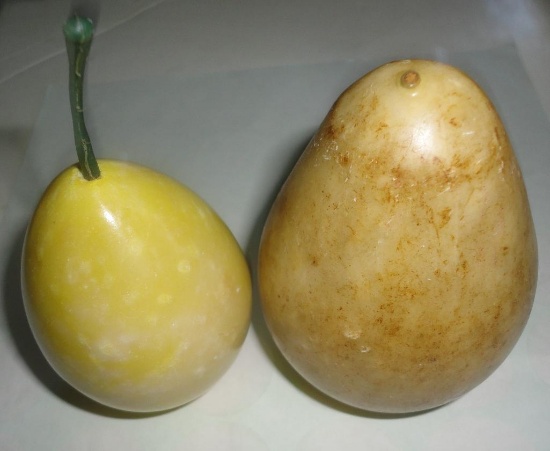 2 PIECES OF MARBLE FRUIT ALL ITEMS ARE SOLD AS IS, WHERE IS, WITH NO GUARANTEE OR WARRANTY. NO