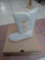 PAIR OF UGG WINTER BOOTS WITH THREE BUTTON SIDE, FUR IN THE INSIDE AND COLOR IS BEIGE.