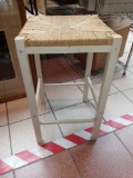 WHITE METAL BASE BAR STOOL, WITH A RUSH SEAT PART, MEASUREMENTS ARE APPROXIMATELY 14 IN X 14 IN X 24
