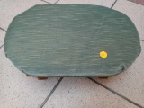 SMALL WOODEN ROCKING STOOL, WITH A GREEN FELT TOP.