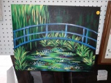 CANVAS PAINTING OF A WALKING BRIDGE OVER POND, MEASUREMENTS ARE APPROXIMATELY 20 IN X 16 IN.