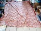 RED FRENCH TOILE DRAPE WITH TASSELS MEASUREMENTS ARE APPROXIMATELY 85 IN X 107 IN., DRAPE IS WEATHER