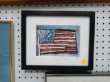 BLACK FRAMED PRINT OF THE AMERICAN FLAG, MEASUREMENTS ARE APPROXIMATELY 11 IN X 9 IN.