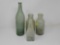 FOUR ANTIQUE DUG BOTTLES 8 IN TALL. ONE IS A BLOWN BOTTLE.