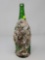 GREEN BOTTLE WITH BARNACLE AND CLAM SHELLS AT 15 INCHES TALL