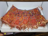 BEADED APRON IN NATIVE AMERICAN DESIGN, MADE FROM UNKNOWN MATERIAL.