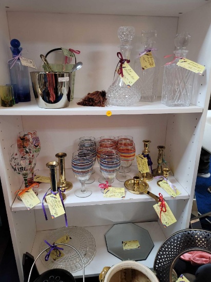 (RM1) LOWER 3 SHELVES OF BOOKCASE. INCLUDES: 3 GLASS DECANTERS, METAL ICE BUCKET AND ACCESSORIES, A