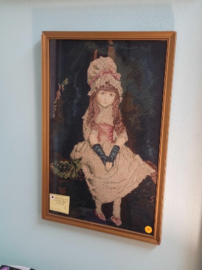 (RM1) FRAMED VINTAGE NEEDLEPOINT DEPICTING AN EARLY YOUNG GIRL IN A WHITE AND PINK DRESS POSING. IT