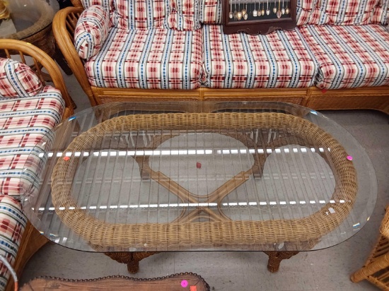 (R1) OVAL WICKER PATIO COFFEE TABLE, WITH BEVELED GLASS, MEASUREMENTS ARE APPROXIMATELY 53 IN X 28