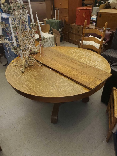 ROUND OAK TABLE WITH 2 LEAVES, TABLE IS WORN FROM USE, AND HAVE SCRATCHES AND BLEMISHES, 54 1/4"D 53