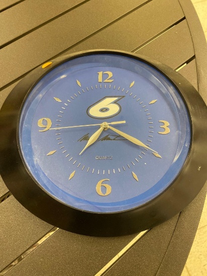 QUARTZ WALL HANGING ROUND BLUE AND BLACK MARK MARTIN CLOCK WITH THE NUMBER 6 ON IT CLOCK TAKES