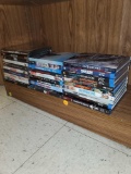 SHELF LOT OF 30 DVD AND BLUERAY MOVIES, STAR BLAZERS, GEOSTORM, MILE 22, BLACK AND BLUE, WAVES, THE