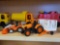LOT OF 2 ORANGE TRACTOR TOYS. ALSO INCLUDES A WHITE PULL BEHIND TRAILER.