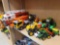 LOT OF ASSORTED TOYS. INCLUDES TRACTORS, FIRE TRUCK WITH SOUND, MAXX HAULERS WITH HELICOPTER, AN