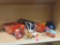 LOT OF ASSORTED TOYS. INCLUDES LIGHTNING MCQUEEN CARS, TRACTOR TRAILER, A CAR HAULER, A RACECAR,