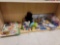 SHELF LOT OF ASSORTED TOYS. INCLUDES AN ARROW WALL DECOR WITH 3 HOOKS, DINOSAUR TOYS, A WOODEN
