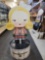HARAJUKU LOVERS G CARDBOARD CUT OUT. SITS ON ROUND FOLDING BASE. MEASURES APPROX 12