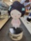 HARAJUKU LOVERS BABY CARDBOARD CUT OUT. SITS ON ROUND FOLDING BASE. MEASURES APPROX 12