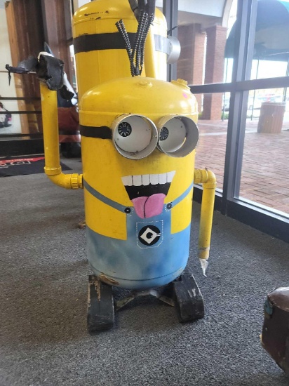 BENCHMADE METAL MINIONS YARD ORNAMENT. MADE FROM AN OLD TANK, PAINTED BLUE AND YELLOW. GLOVES NEED